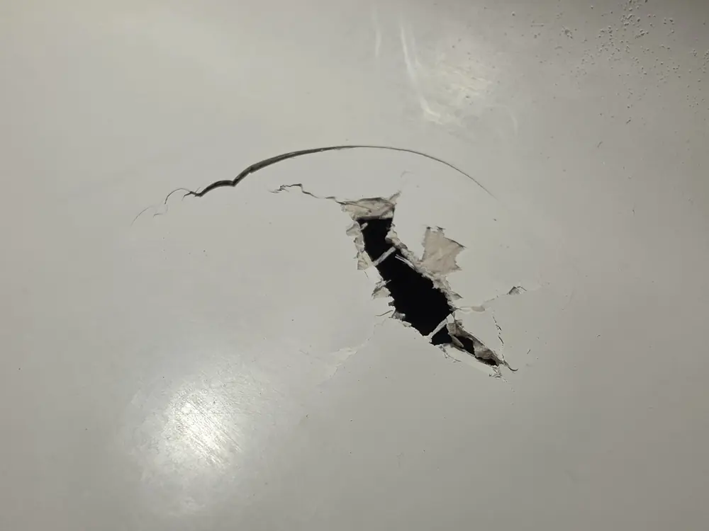 Knee punch damage to the inner wall before repair