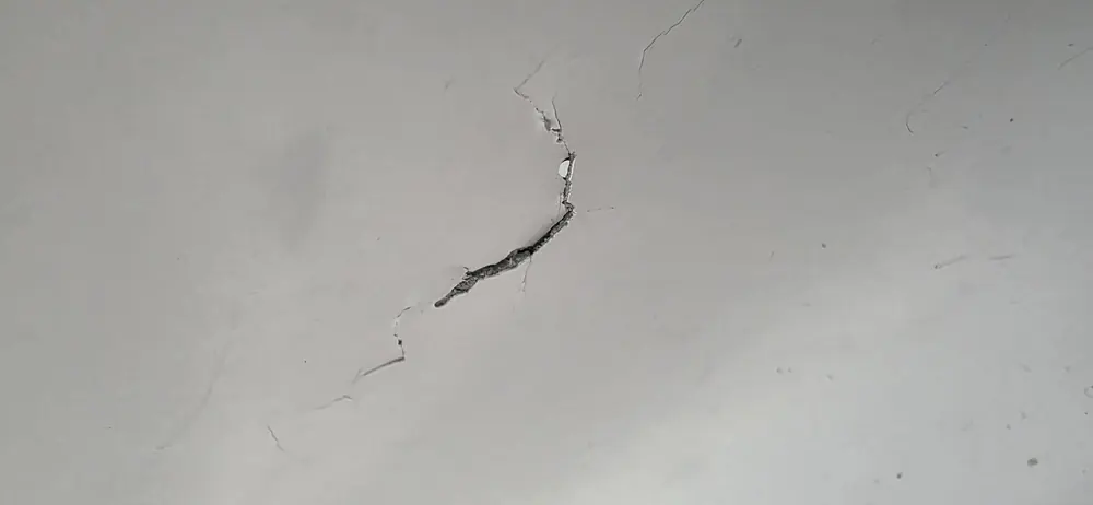 Ankle punch damage to the inner tub wall before repair